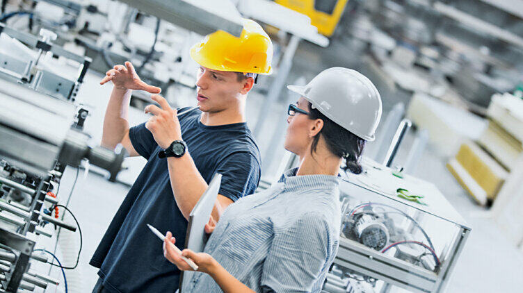 Man and woman talking over a Machinery Safety